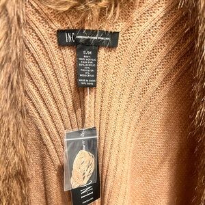 Camel color cape. Perfect for jeans and a turtleneck to make the perfect outfit.